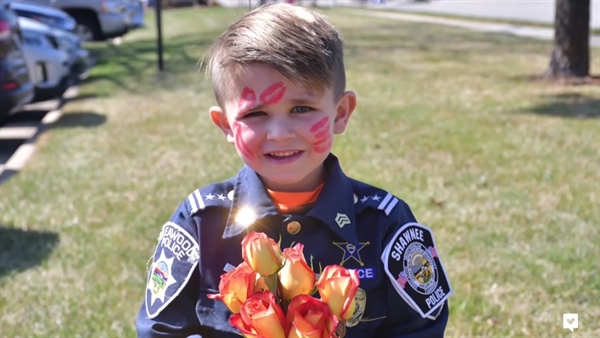 Oliver the Kid Cop Hands Out Flowers at Nursing Homes