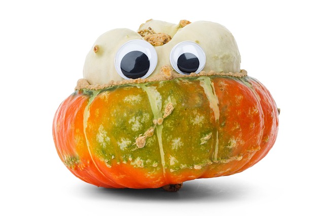 a small pumpkin adorned with googly eyes