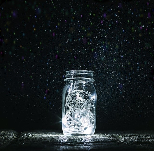 A mason jar with lights inside