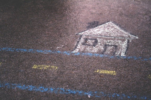 Sidewalk chalk art of a house